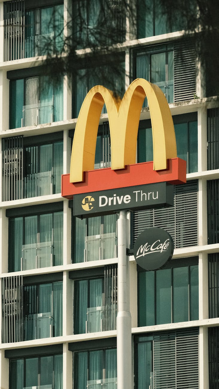 mcdonalds logo over building windows