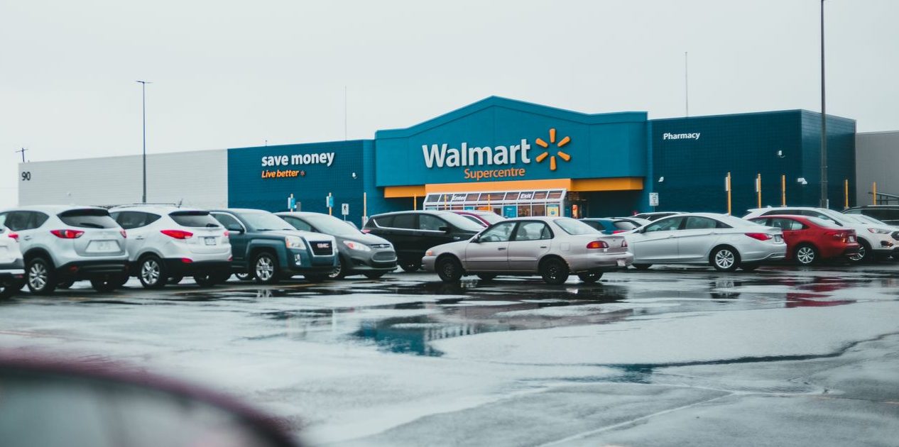 car parked in parking lot near shop